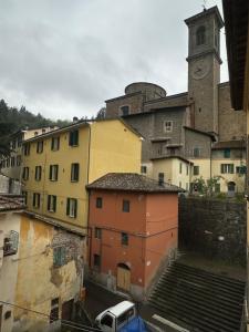 a group of buildings with a clock tower at La rampata in Porretta Terme