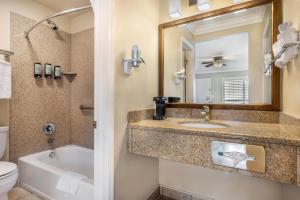 a bathroom with a sink and a tub and a toilet at Best Western Tradewinds in Morro Bay +48 photos