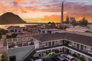 an aerial view of a town with a sunset at Best Western Tradewinds in Morro Bay