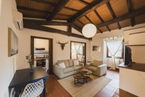 a living room with a couch and a fireplace at Agriturismo Pimpinnacolo in Porto Ercole