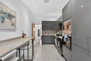 a kitchen with a washer and dryer at The Oak Nest in Otford