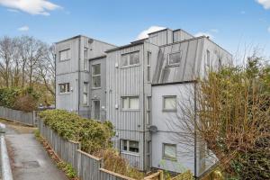 an apartment building with a fence in front of it at The Oak Nest in Otford