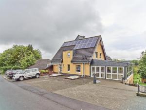 a house with solar panels on top of it at Haus Eifelsonne in Ramscheid