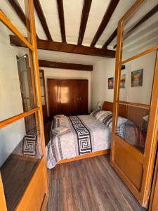 a bedroom with a bed in a room at Cal Padrí in Caseras +19 photos