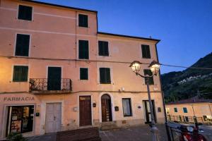 a building with a street light in front of it at Borgo & Terrazza - Le Case di Rio in Rio nellʼElba