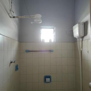 a bathroom with a shower and a window at Hotel Bela Vista in Costa Marques +99 photos