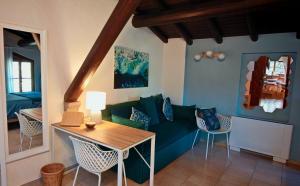 a living room with a couch and a table at Cascina Silene in Castelmarte