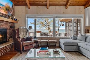 a living room with a couch and a fireplace at Gasthaus Fox by Juniper Holiday + Home in Bridgman