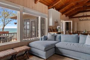 a living room with a couch and a view of the ocean at Gasthaus Fox by Juniper Holiday + Home in Bridgman +42 photos