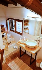 a bathroom with a sink and a mirror at Cascina Silene in Castelmarte +91 photos