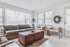 a living room with a couch and a coffee table at Hygge House in Harbert