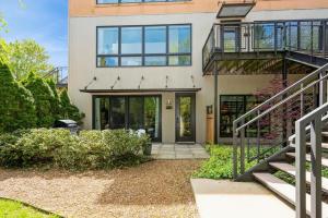 a house with a staircase leading to the front door at The Vineyard Loft in Harbert