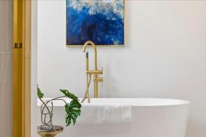 a bathroom with a sink with a faucet at Cozy Haven in Three Oaks