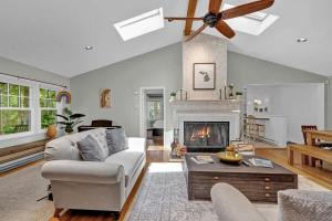a living room with a couch and a fireplace at Wonderwood Cottage in Sawyer