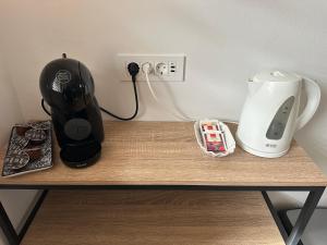 a counter with a coffee maker and a blender on it at Crystal Lakes Apartment in Plitvička Jezera