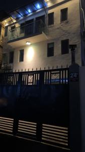 a fence in front of a building at night at Aiidraproperties in Lagos
