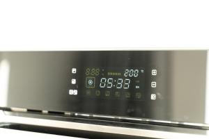 a microwave oven with a clock on the screen at Coastal Escape in Burtonport