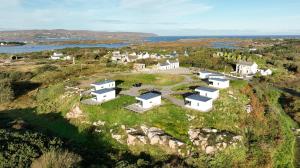 an aerial view of a house on a hill at Coastal Escape in Burtonport +32 photos