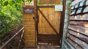 a wooden door on the side of a building at Mariposa - Casa Corazon Mazunte in Mazunte +10 photos