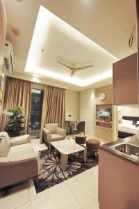a living room with a couch and a table at Town Centers in Ghaziabad +18 photos