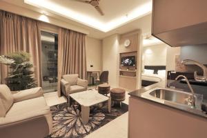 a room with a kitchen and a living room at Town Centers in Ghaziabad