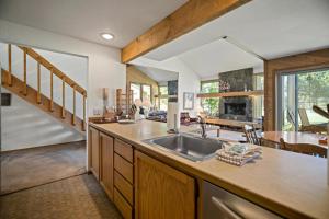 a kitchen with a sink and a dining room at 17 Quelah Condo in Sunriver