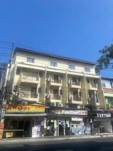 a building on the corner of a street at Sea Place Pattaya Soi 7 in Pattaya