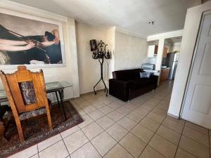 a living room with a couch and a table at Birdhouse in Guanajuato +24 photos