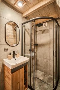 a bathroom with a sink and a shower at ULISI house in Verkhniy Yasenov +30 photos