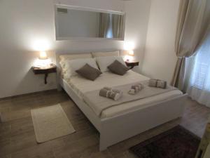 Кровать или кровати в номере Casa Micheli in Centro ex Frattina Luxury Apartment