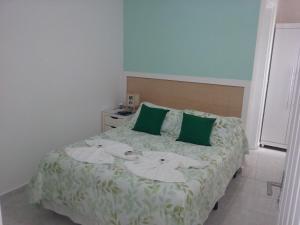 Cama ou camas em um quarto em Pousada Irashai