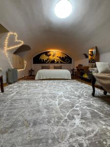 a bedroom with a large bed in a room at Уютная комната in Ganja