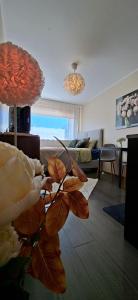 a living room with a couch and a table at Laine Apartment in Pärnu