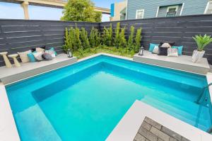 a swimming pool in the backyard of a house at 14BR Downtown Combo & Shared Seasonal Pool in New Orleans
