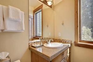 a bathroom with a sink and a mirror at Slopeside Villa 126 Next To WP Resort I Steam Shower I Great Views I Private Hot Tub I Activity Program in Winter Park +19 photos