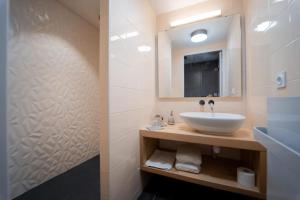 a bathroom with a sink and a mirror at L'Azimut in Senez +13 photos