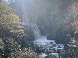 a waterfall in the middle of a river at Alma de Barro in El Puente del Arzobispo +3 photos