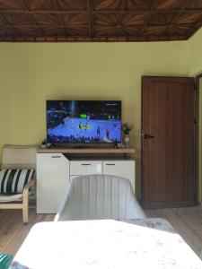 a living room with a flat screen tv on a wall at Апартамент за гости Вамсон in Velingrad