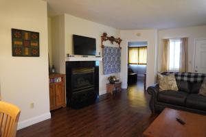 a living room with a couch and a fireplace at River Place Condos #508 2BD in Pigeon Forge