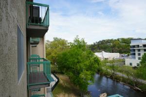 a view of a river from a balcony of a building at River Place Condos #508 2BD in Pigeon Forge