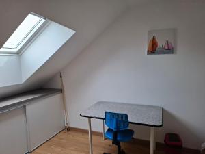 a room with a table and a window at Escale cosy à Blois in Blois