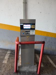 a parking meter sitting on the side of a building at Anchor House in Câmara de Lobos