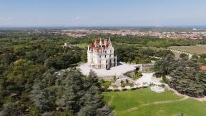 an aerial view of a castle on a hill at Château de Valmy - Chambres d'hôtes in Argelès-sur-Mer
