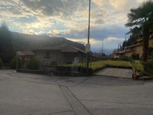 a house with a fire hydrant in a parking lot at Casa Elisa in Onore