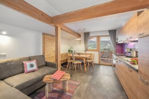 a living room with a couch and a table at Ferienbauernhof Wieserhof in Völs am Schlern