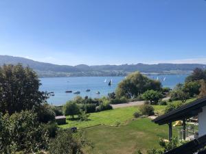 a view of a lake with boats in the water at Ferienwohnung Untersee in Öhningen