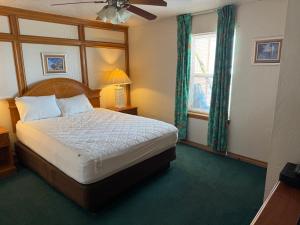 a bedroom with a large bed and a window at Sierra Suites in Daytona Beach +52 photos