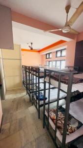 a room with a bunch of bunk beds in it at Delight rooms in Mysore