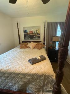 a bedroom with a large bed with a wooden frame at Palace priv april in Decatur