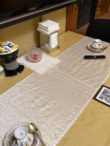 a table with a table cloth on top of it at Vintage Stile in Ganja